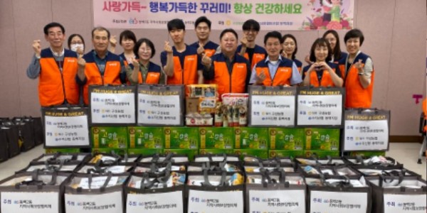 동백2동이 24일 저소득 50가구에 식료품꾸러미를 전달하였다.jpg